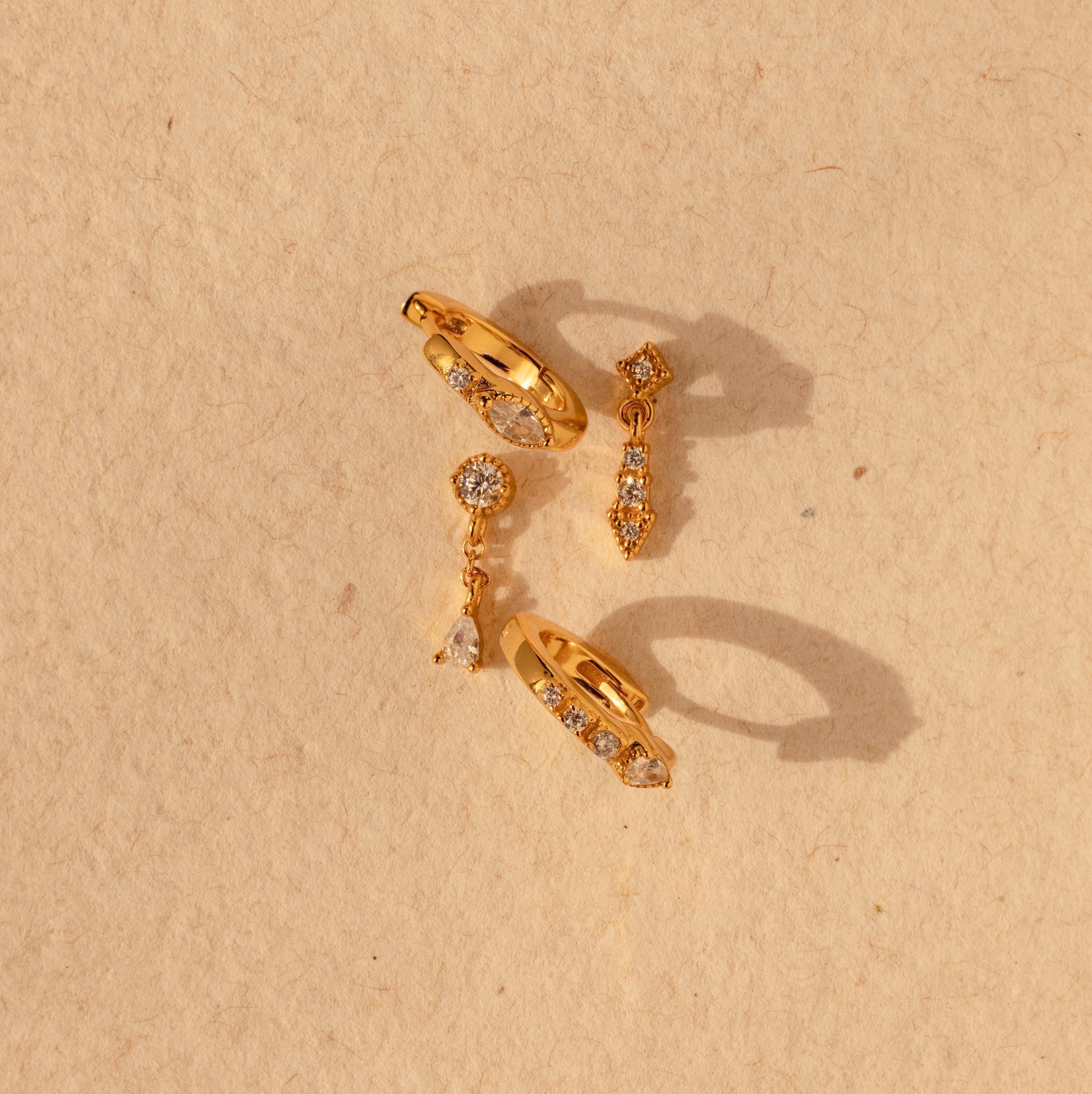 Gold pavé earrings set with sparkling CZ diamonds.